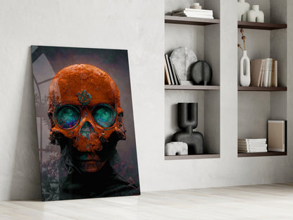 Orange and teal skull glass art leaning against white wall beside shelving unit with decorative objects and books.