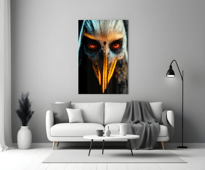 Glass wall art depicting an eagle's face with glowing red eyes and golden beak against dark background, displayed above white sofa in modern living room.