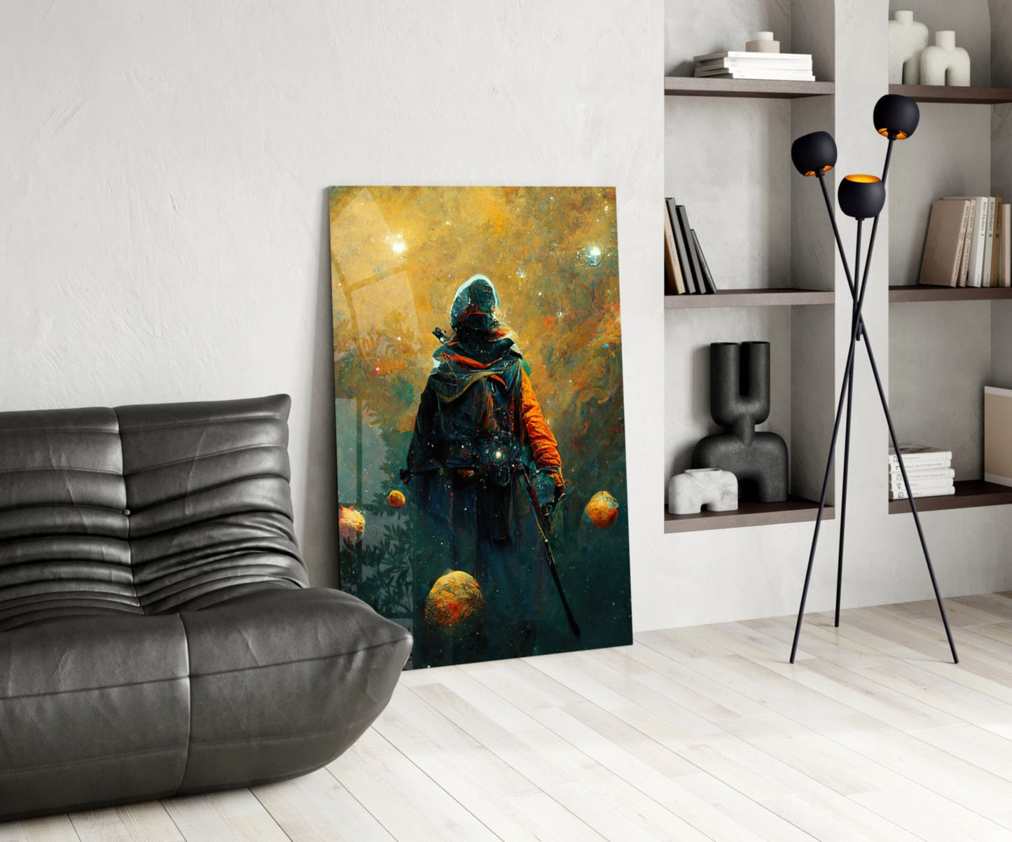 Modern living room interior featuring a vertical glass wall art panel depicting a hooded figure in dark clothing surrounded by golden spheres against a golden-yellow and teal background.