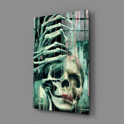 Angled view of glass art panel displaying skull with skeletal hand emerging upward against digital glitch-effect cityscape background in teal and cream tones.