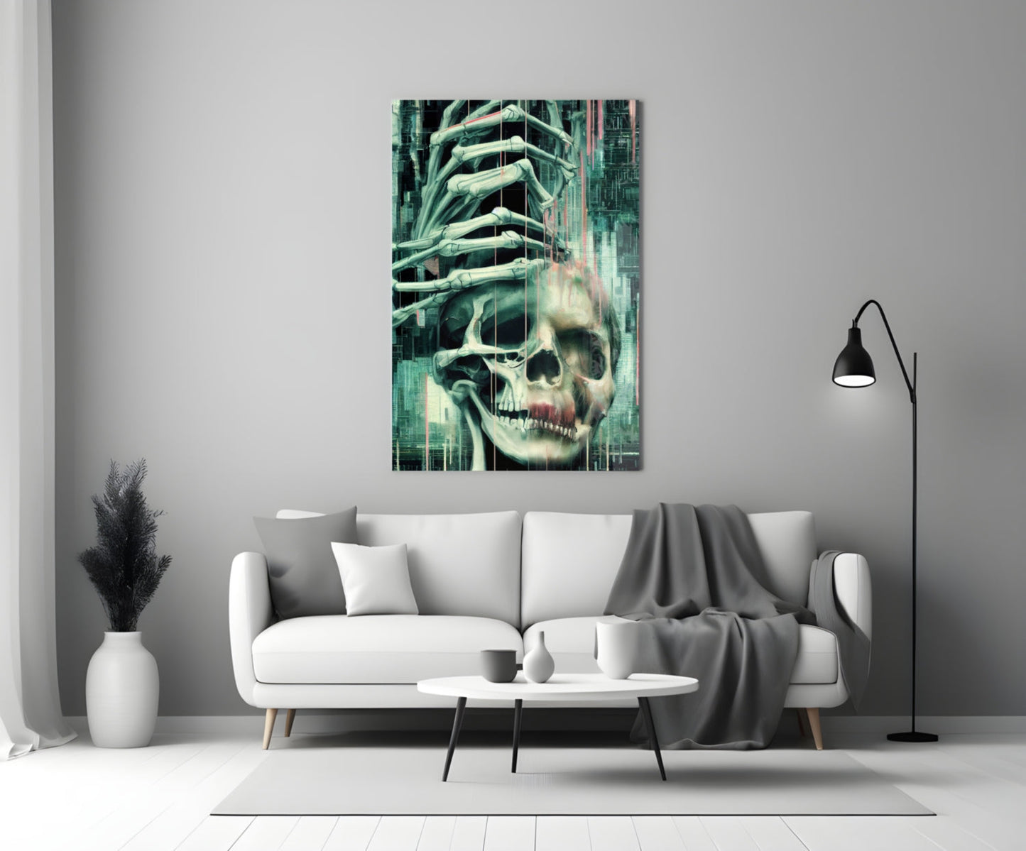 Fall of Skeletons glass art panel mounted on white wall above gray sofa, displaying skull with skeletal hands and green digital overlay.