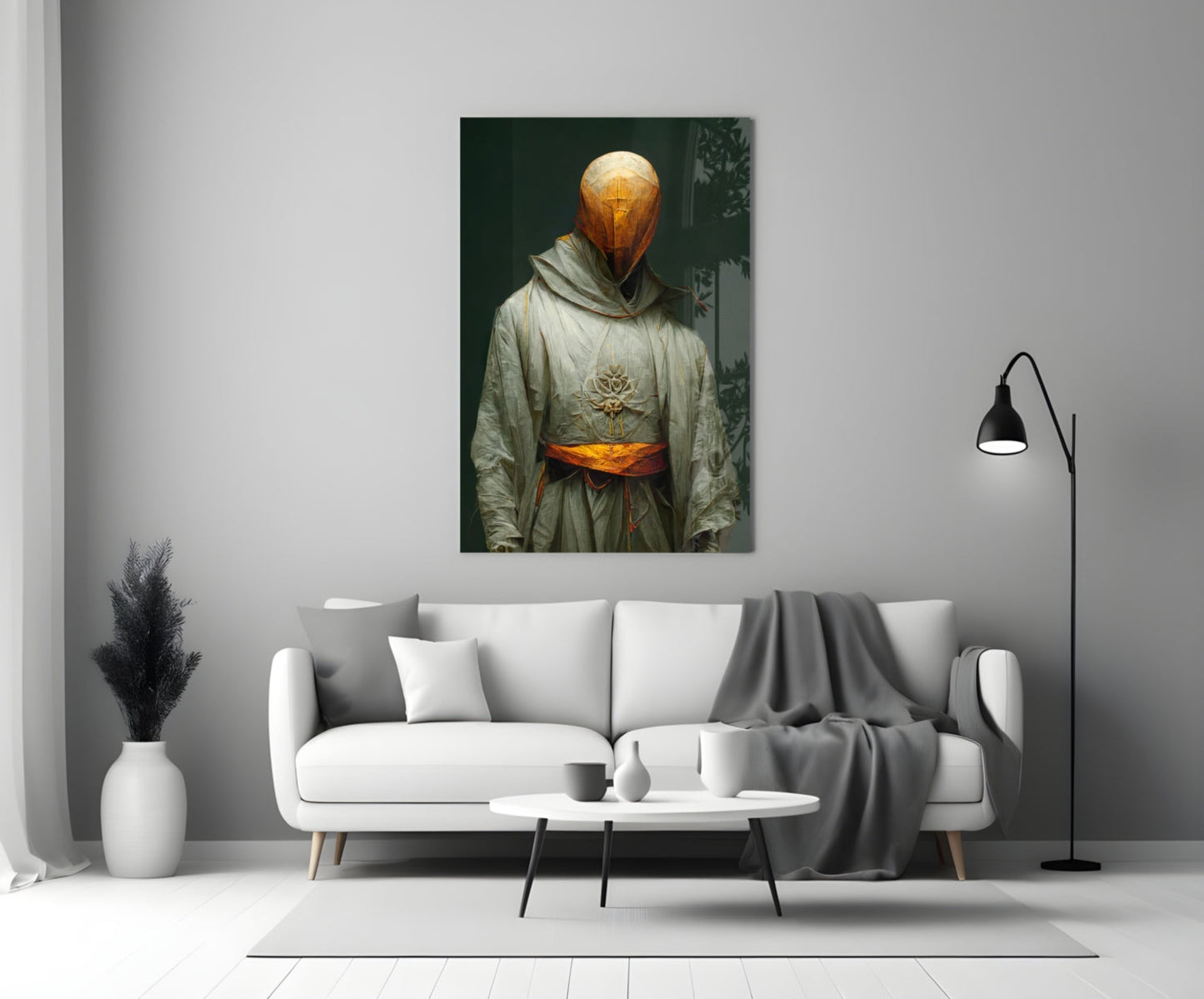 Headless Monk glass art depicting golden glowing orb head with cross symbol, cream robes, and orange belt, displayed above white sofa in modern interior.