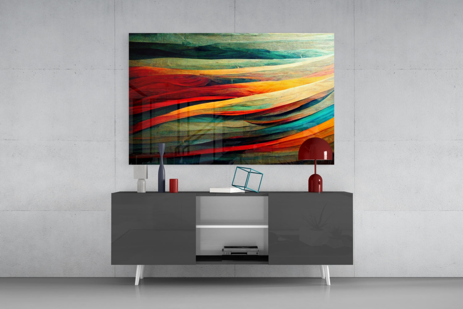 Colorful Flow Glass Art hanging above a dark gray media console with white legs, displaying vibrant red, orange, teal, and green flowing stripes in an interior setting.