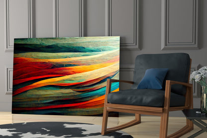 Colorful Flow Glass Art panel with layered red, orange, teal, and green striped design displayed in modern living room beside wooden chair.