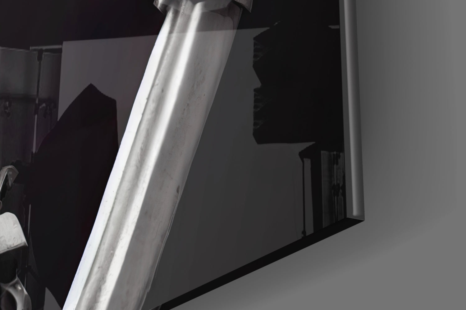 Close-up of white metal pole or support structure against dark background with shadow detail visible.