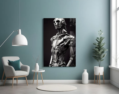 Monochromatic glass art depicting a humanoid robot figure with mechanical details displayed on a teal bedroom wall above a white armchair.