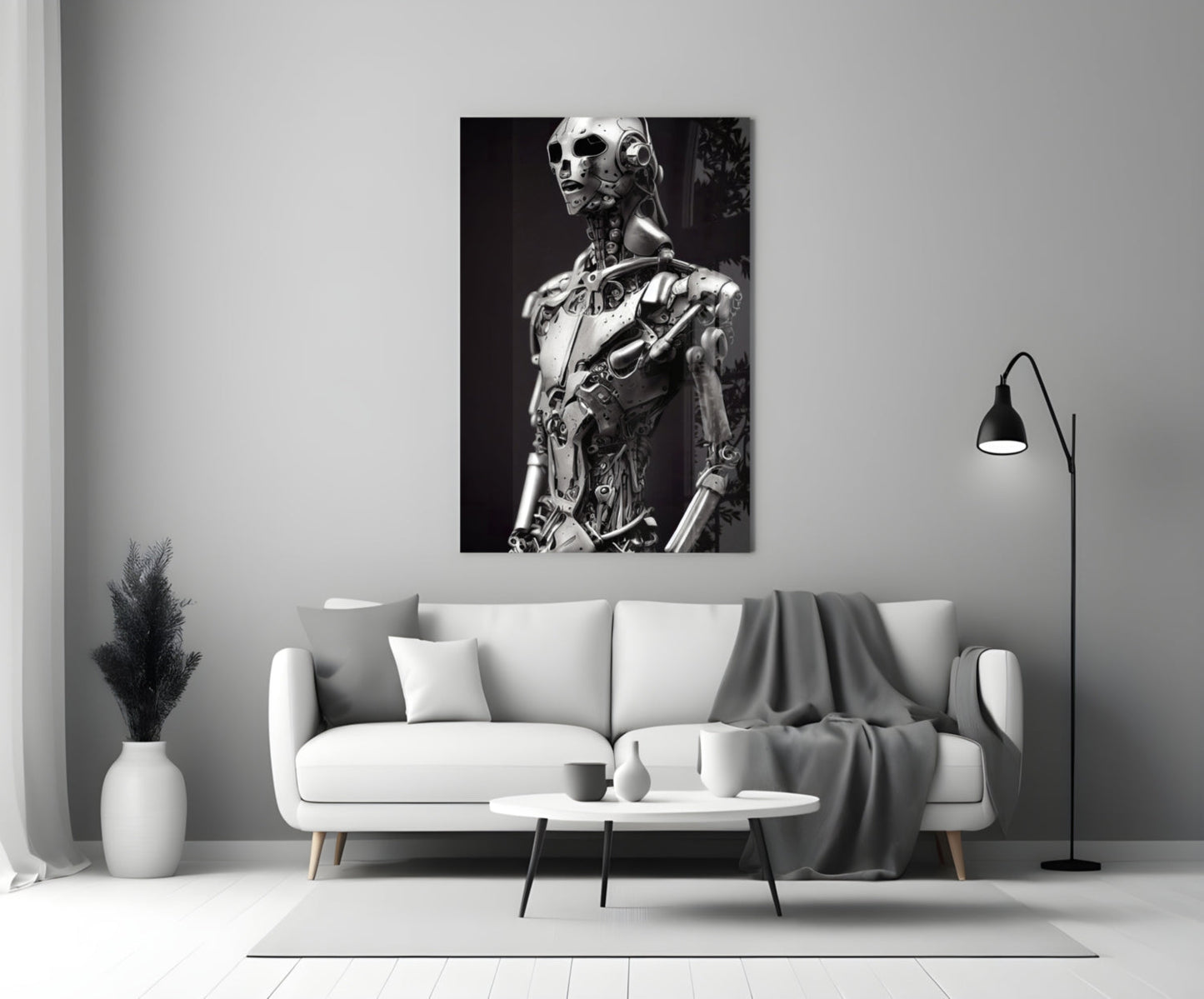 Monochromatic glass art depicting a humanoid robot figure with mechanical details displayed on a living room wall above a white sofa.