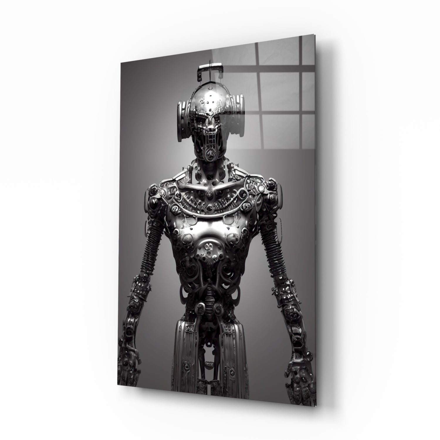 Black and white photograph of an ornate mechanical humanoid figure with elaborate metallic detailing, displayed on glass wall art with gridded window reflection.