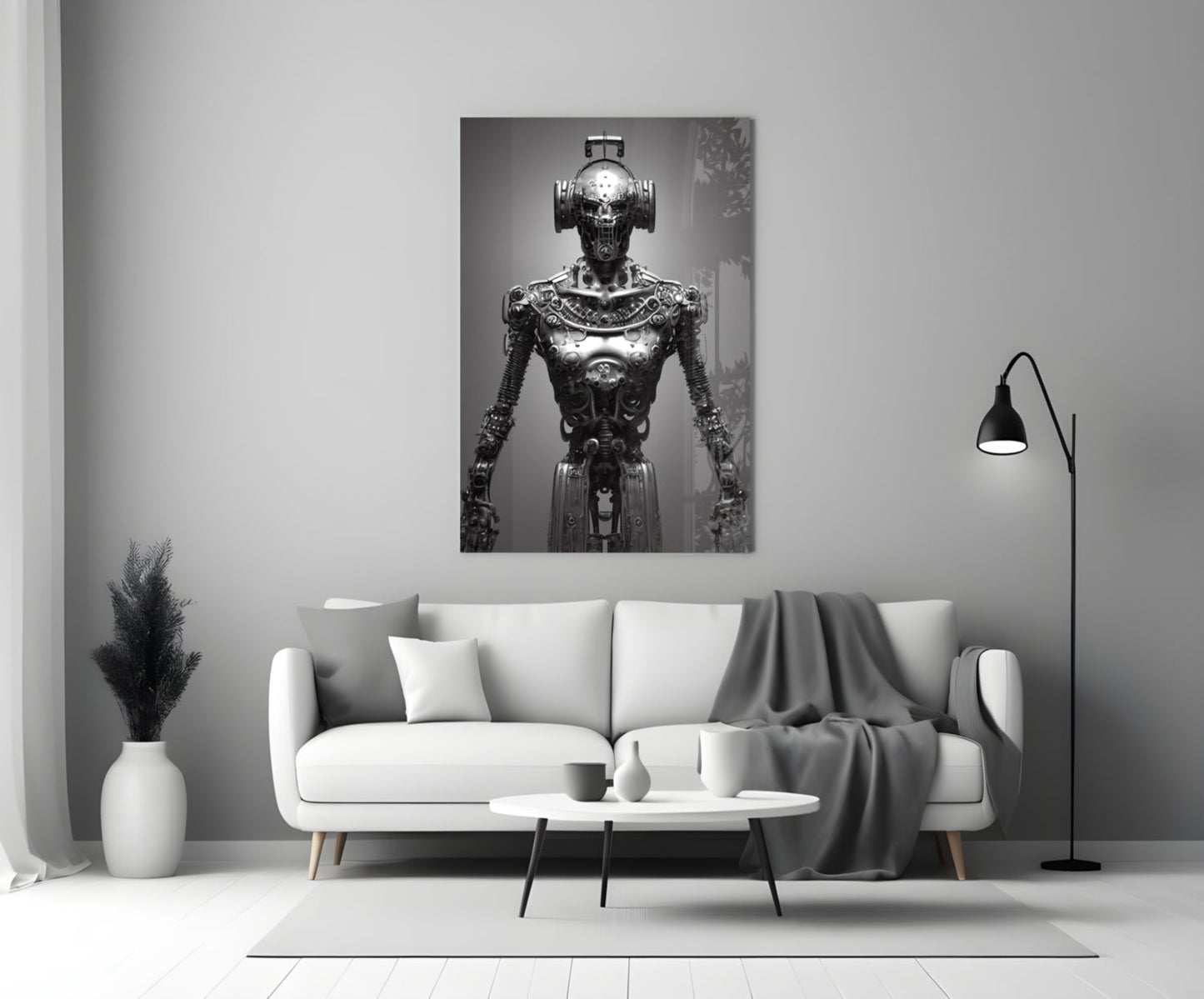 Monochromatic glass art depicting an ornate mechanical humanoid figure displayed above a white sofa in a modern interior.