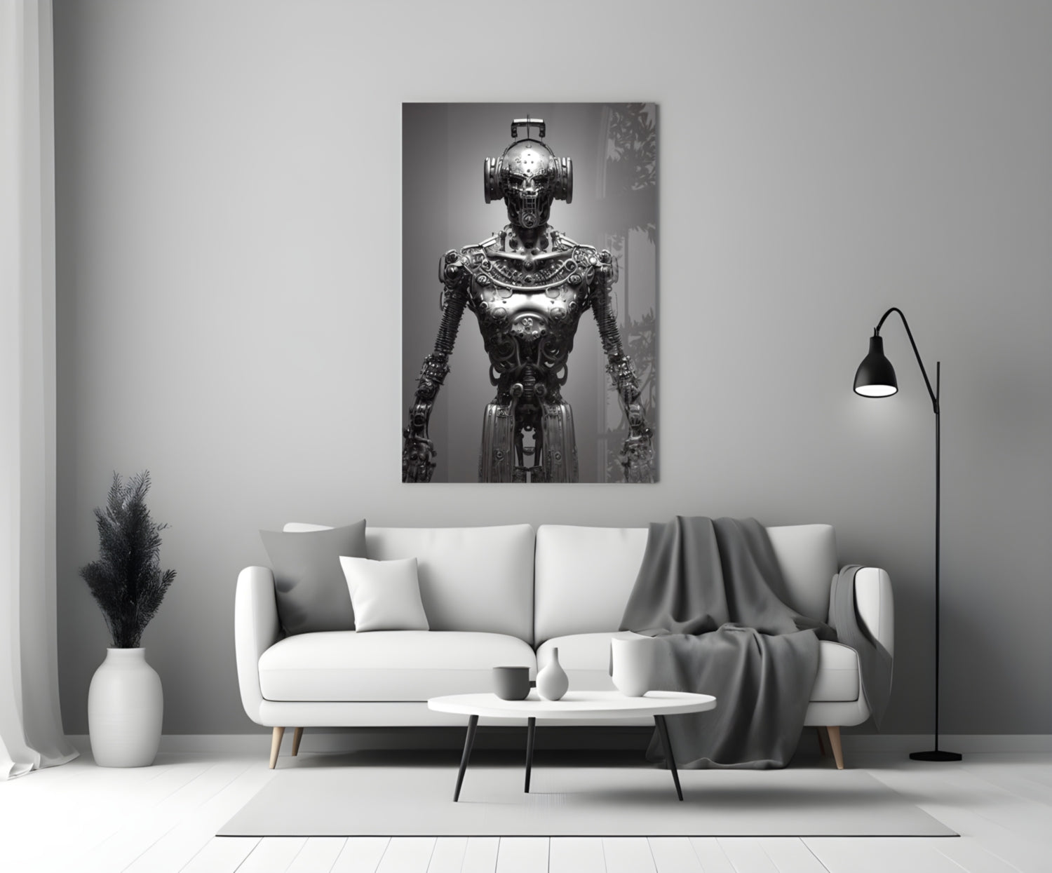 Monochromatic glass art depicting an ornate mechanical humanoid figure displayed above a white sofa in a modern interior.