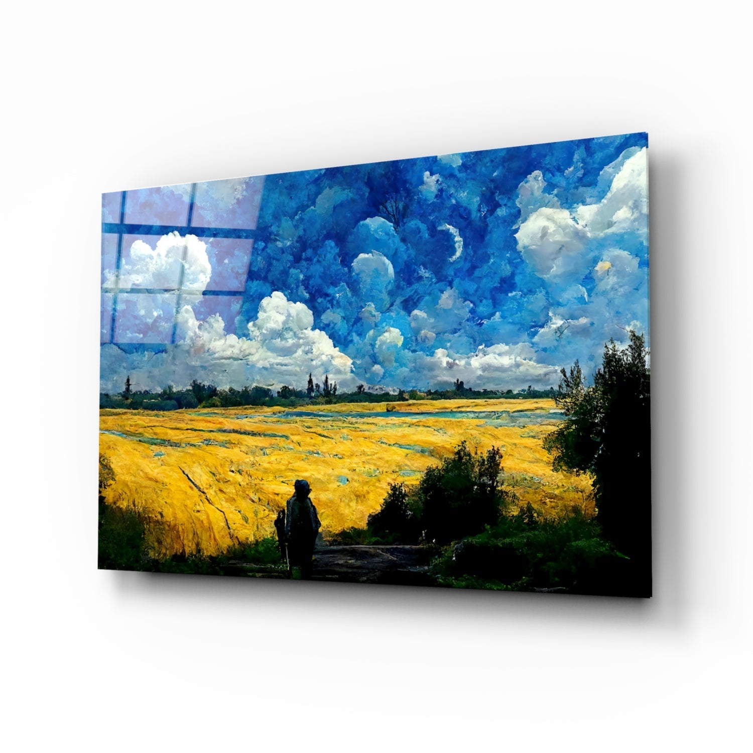 Glass art panel displaying a landscape with golden wheat field, blue sky, white clouds, and silhouetted figure, mounted at angle.