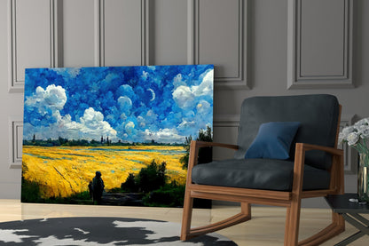 Glass art panel featuring vibrant yellow wheat field with deep blue sky and white clouds displayed in modern interior setting.