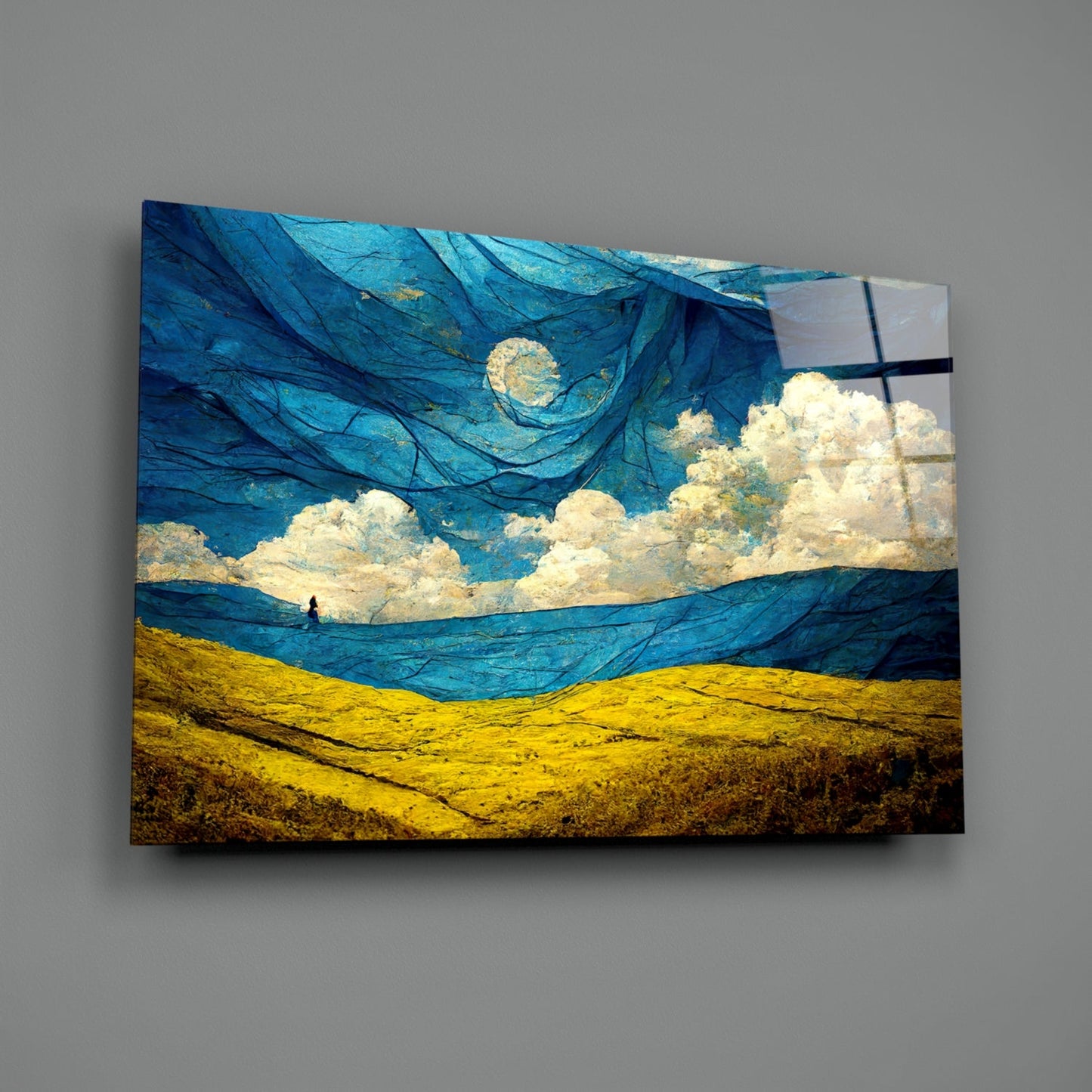 Glass art panel displaying swirling blue sky with cream clouds above golden rolling hills, mounted on gray wall.