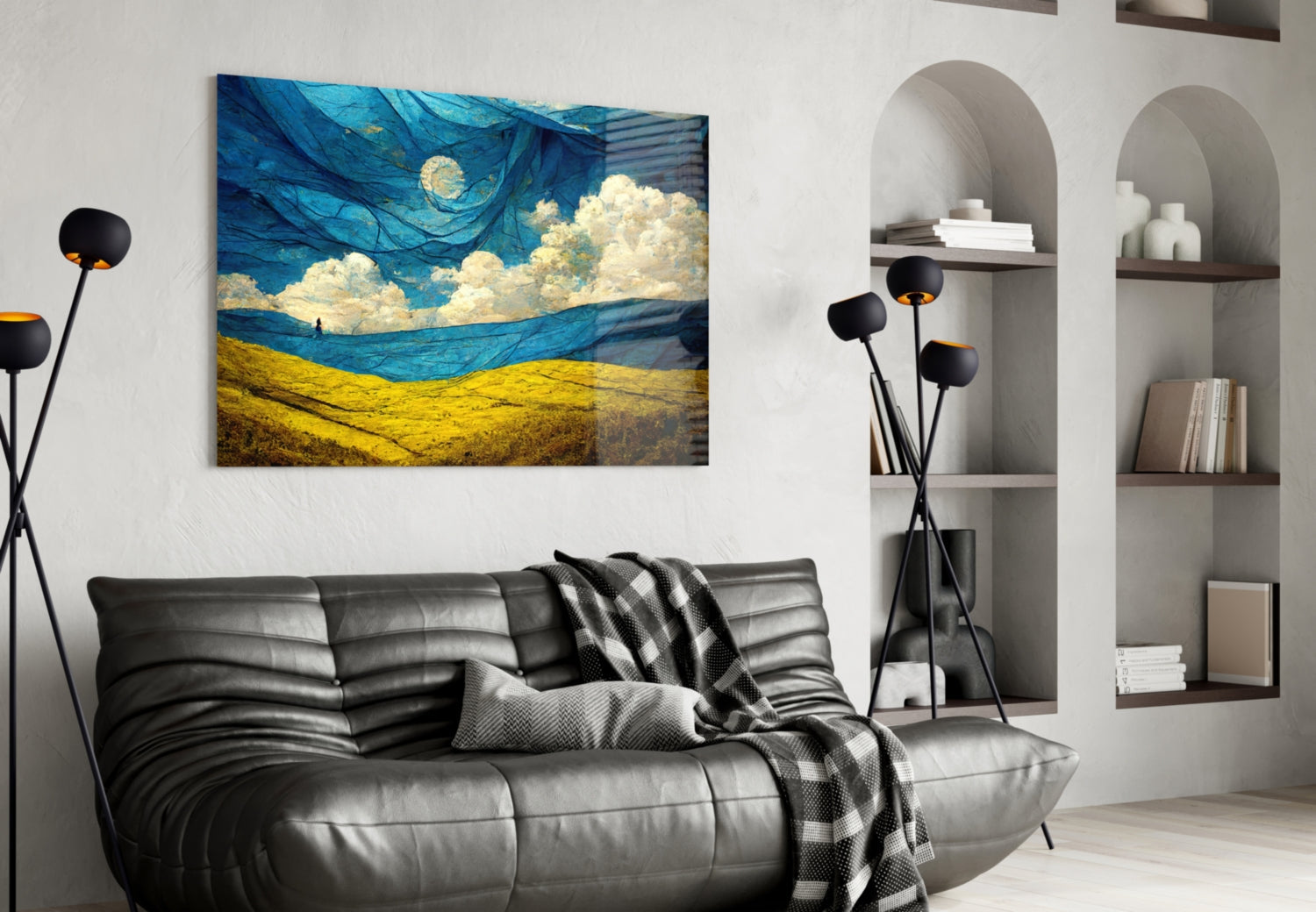 Dancing Sky Glass Art depicting swirling blue sky with yellow wheat field displayed above black sofa in modern living room.