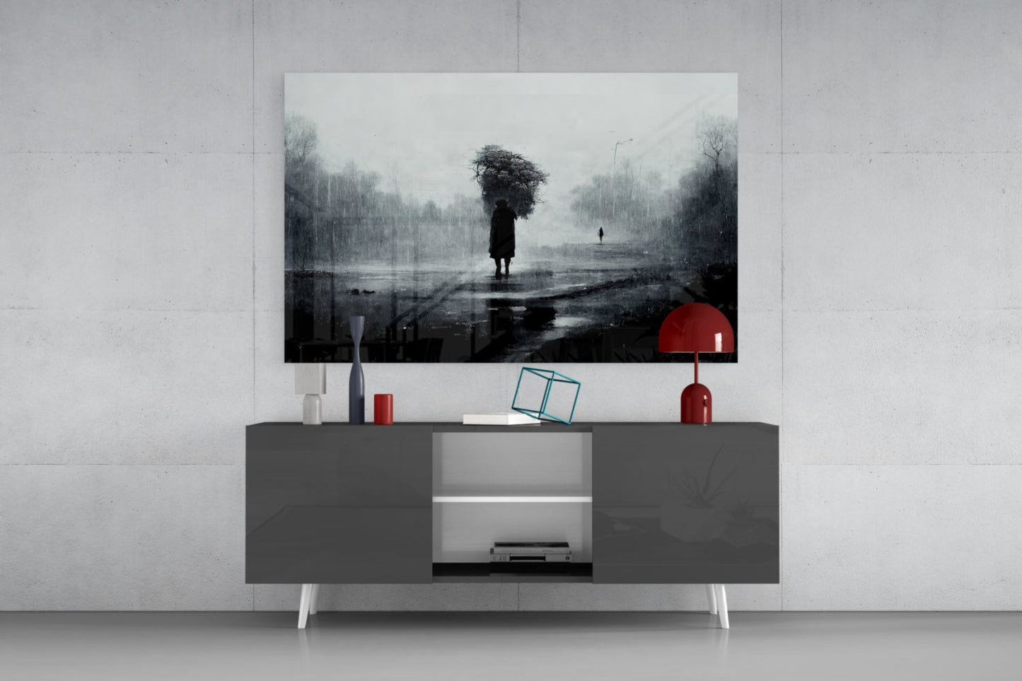 Modern living room setup featuring "Loneliness Glass Art" above gray media console with red accents and decorative items.