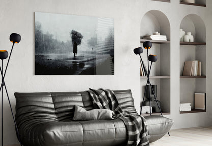 Modern living room featuring black leather sofa with gray throw blanket, black floor lamp, and moody grayscale landscape canvas artwork above seating.