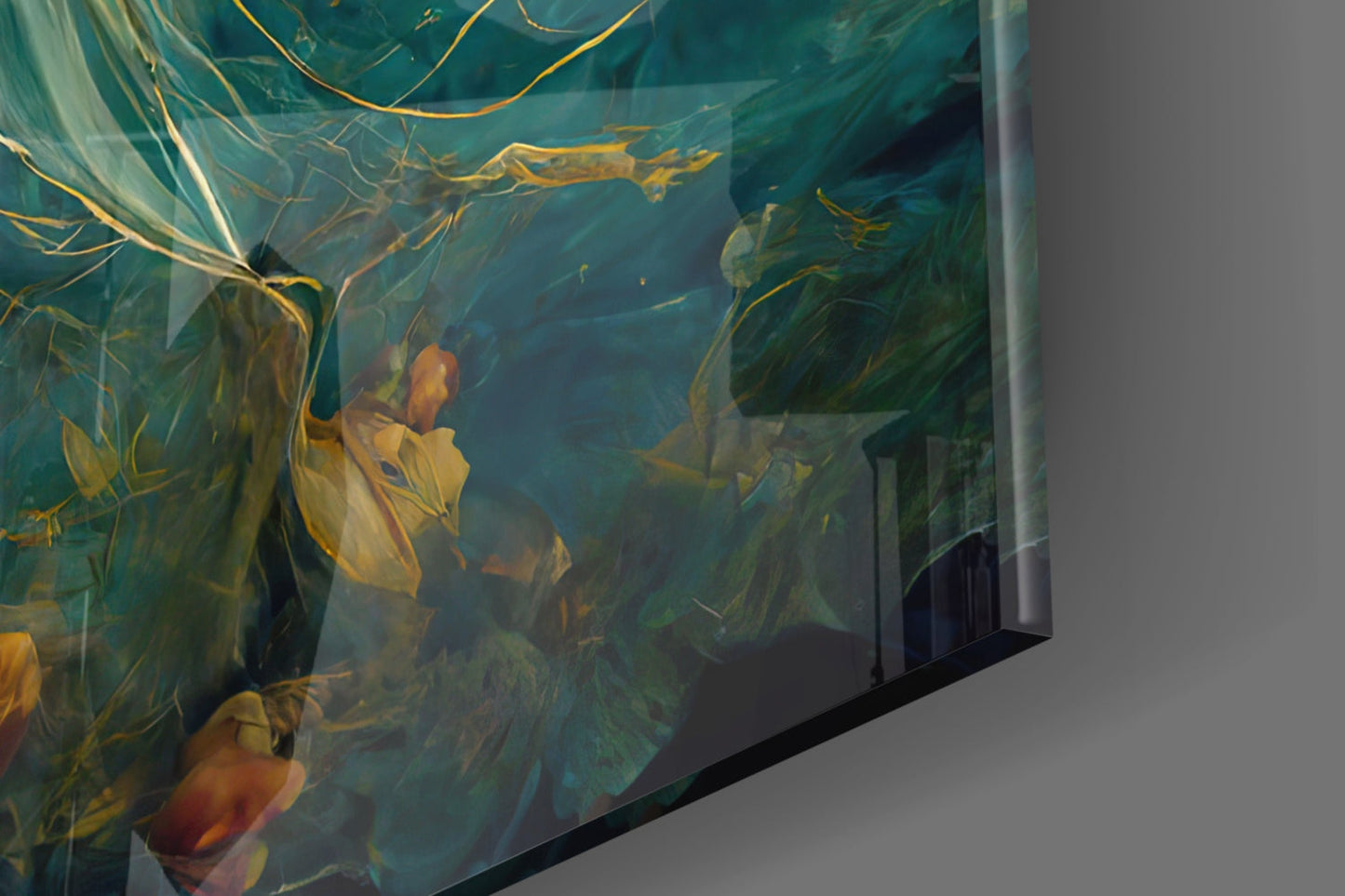 Close-up angled view of glass art panel with teal and yellow botanical imagery, displayed against gray wall.