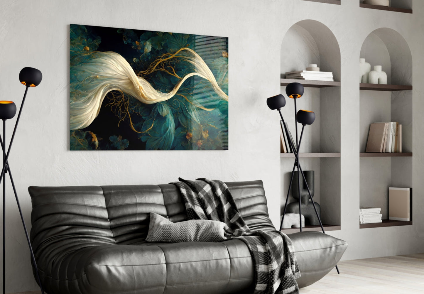 Modern living room with black leather sofa displaying teal and gold abstract glass art above it on white wall.