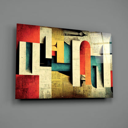 Abstract geometric glass art panel with layered colored blocks in red, teal, yellow, cream, and black, featuring textured paper collage elements, displayed at an angle against gray background.