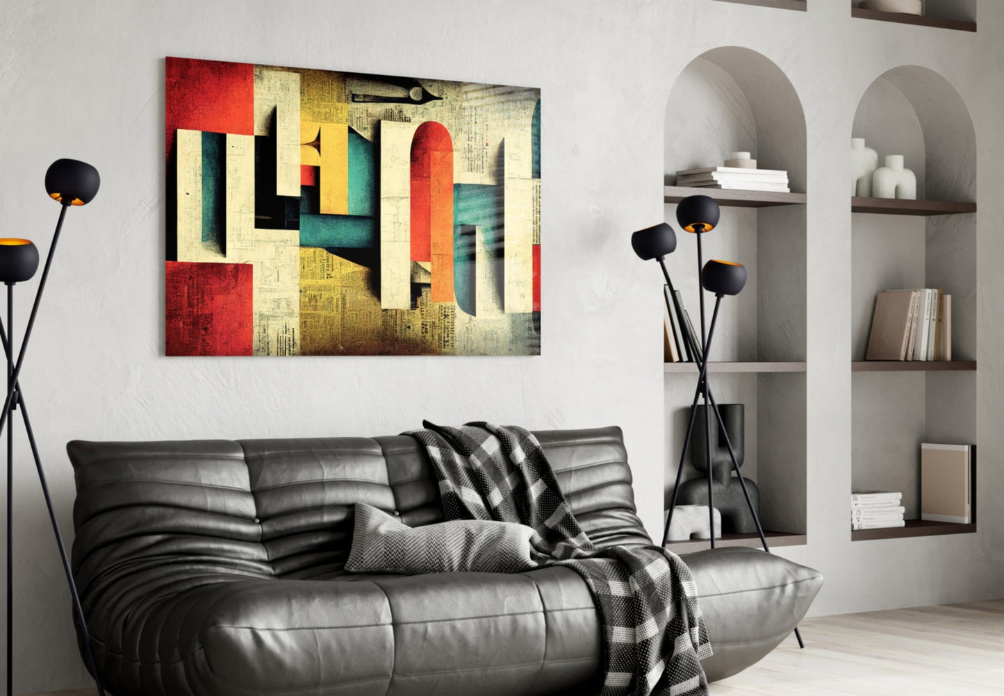 Modern living room interior with abstract geometric glass art print in red, yellow, teal, and cream tones hung above black leather sofa.