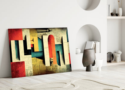 Abstract geometric glass art with red, yellow, teal, and cream layered shapes displayed in minimalist room setting.