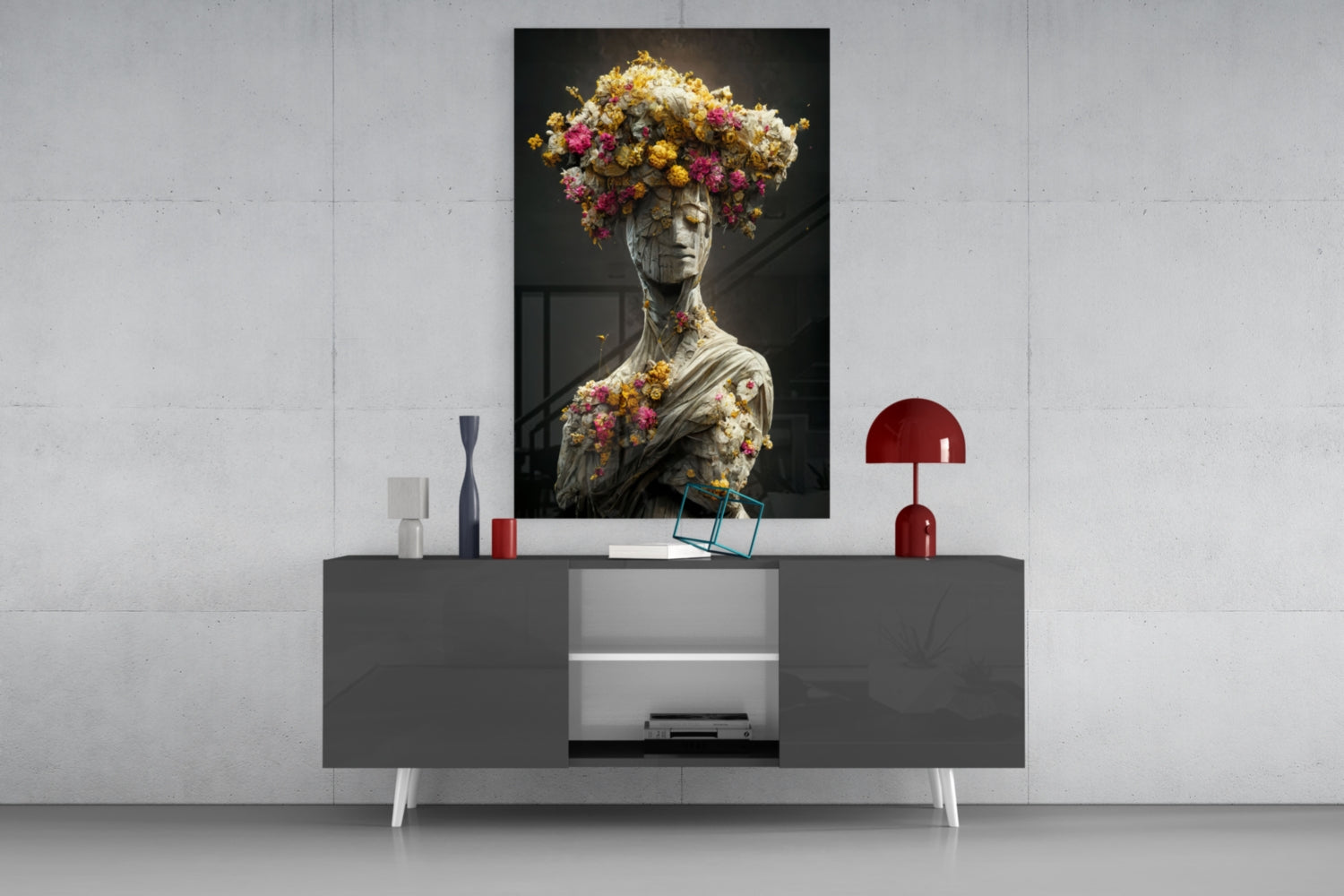 Stone statue adorned with colorful flowers displayed above modern gray media console with red accents.