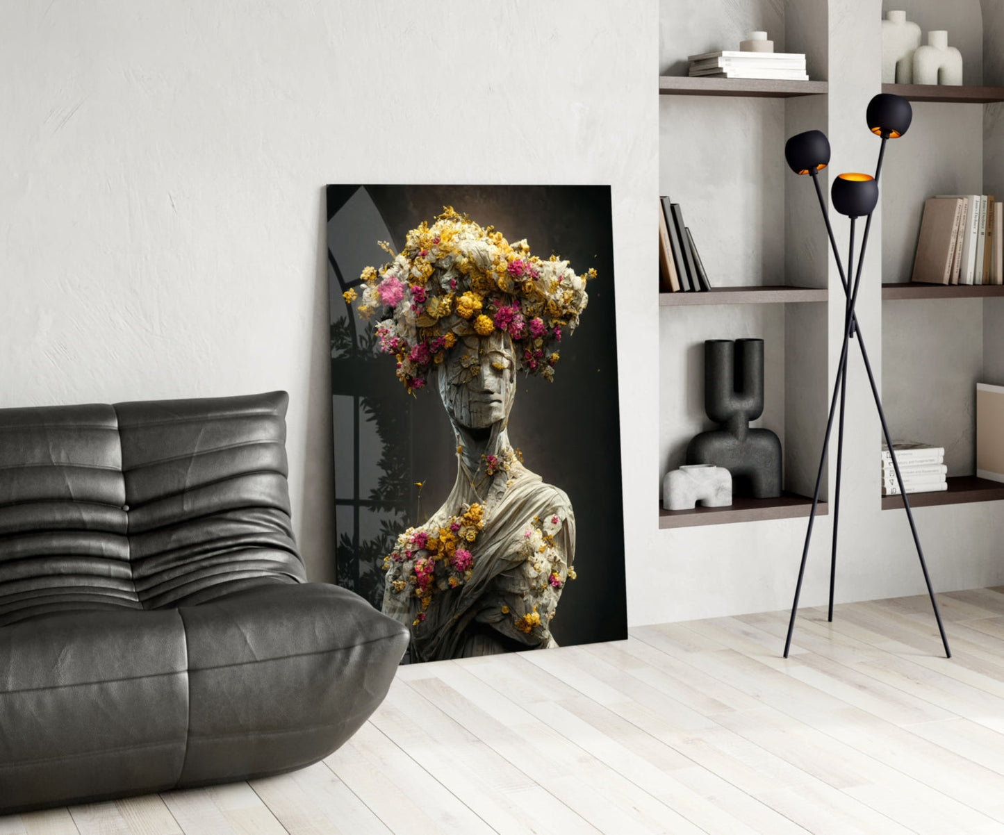 Glass art panel featuring classical statue bust with vibrant yellow, pink, and gold flowers blooming from head and torso against dark background, displayed in modern living room setting.