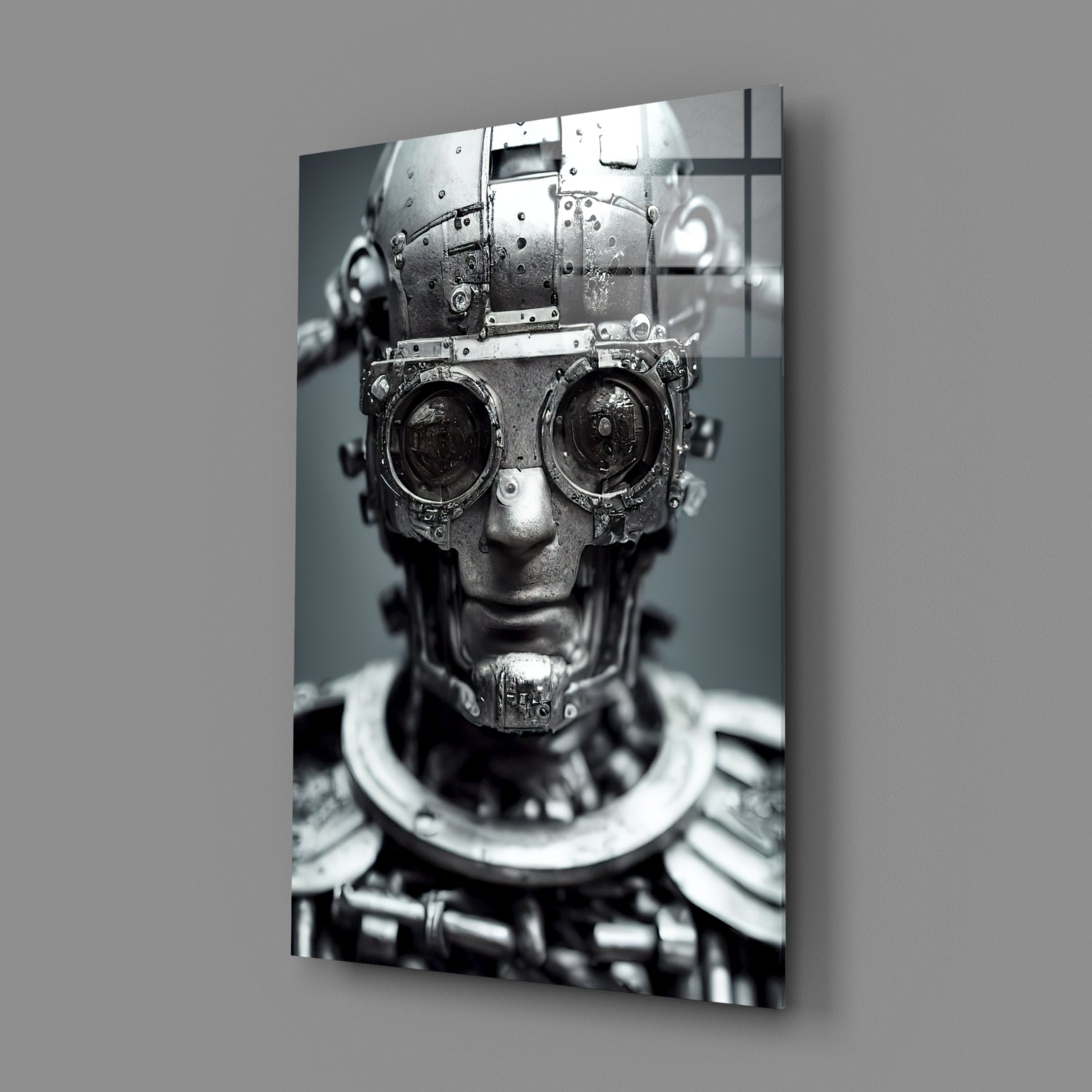 Monochrome glass wall art depicting a mechanical humanoid head with industrial gears and circular lens eyes, mounted at an angle.