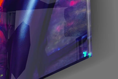 Angled view of illuminated glass wall art displaying moody landscape imagery with blue and pink lighting effects and glowing LED indicators at the base.