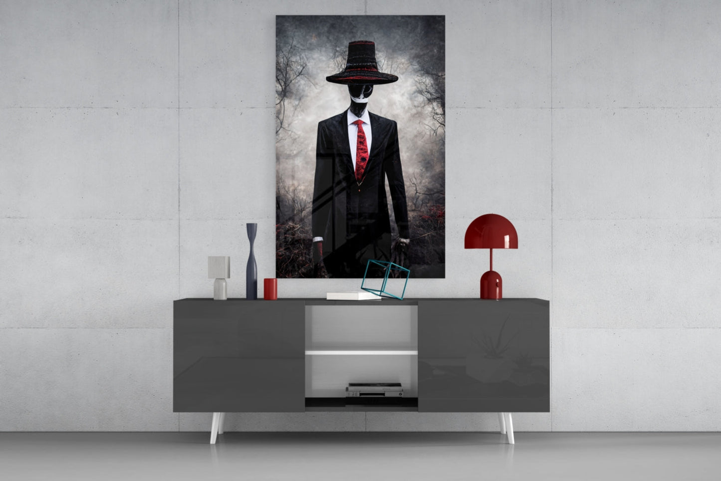 Modern living room display featuring a dark credenza with glass shelving, red decorative lamp, and framed portrait artwork of a figure in black suit with red tie and wide-brimmed hat above.