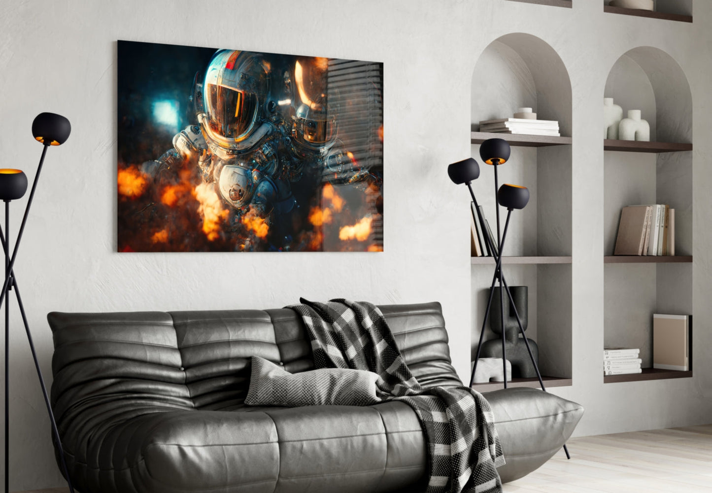 Framed glass wall art depicting a sci-fi astronaut surrounded by orange explosions, displayed above a black leather sofa in a modern living room.