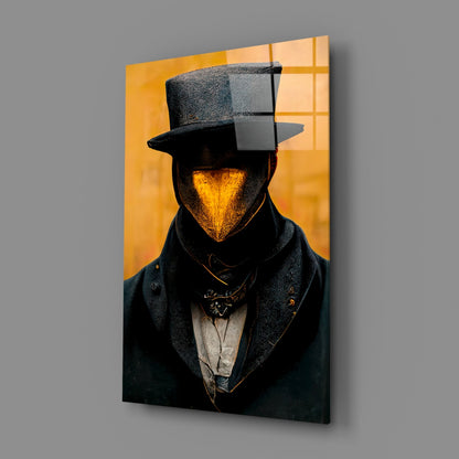 Glass art panel mounted on gray wall showing stylized figure with golden face, black top hat and coat against warm yellow background with geometric grid pattern.