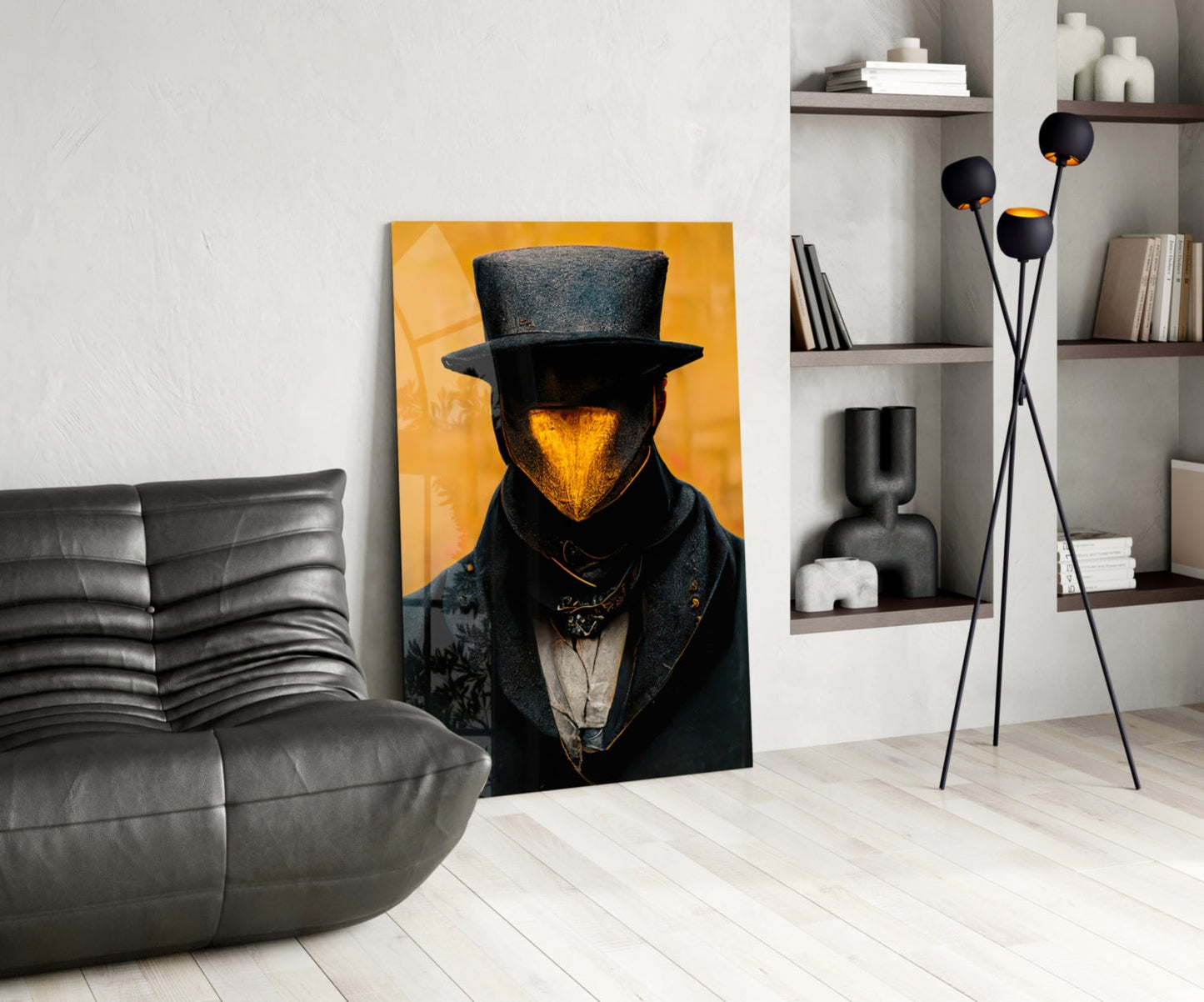 Contemporary living room with "Mr. Beak" artwork featuring a top-hatted figure with golden face against yellow background, displayed next to gray leather sofa and black decorative floor lamp.