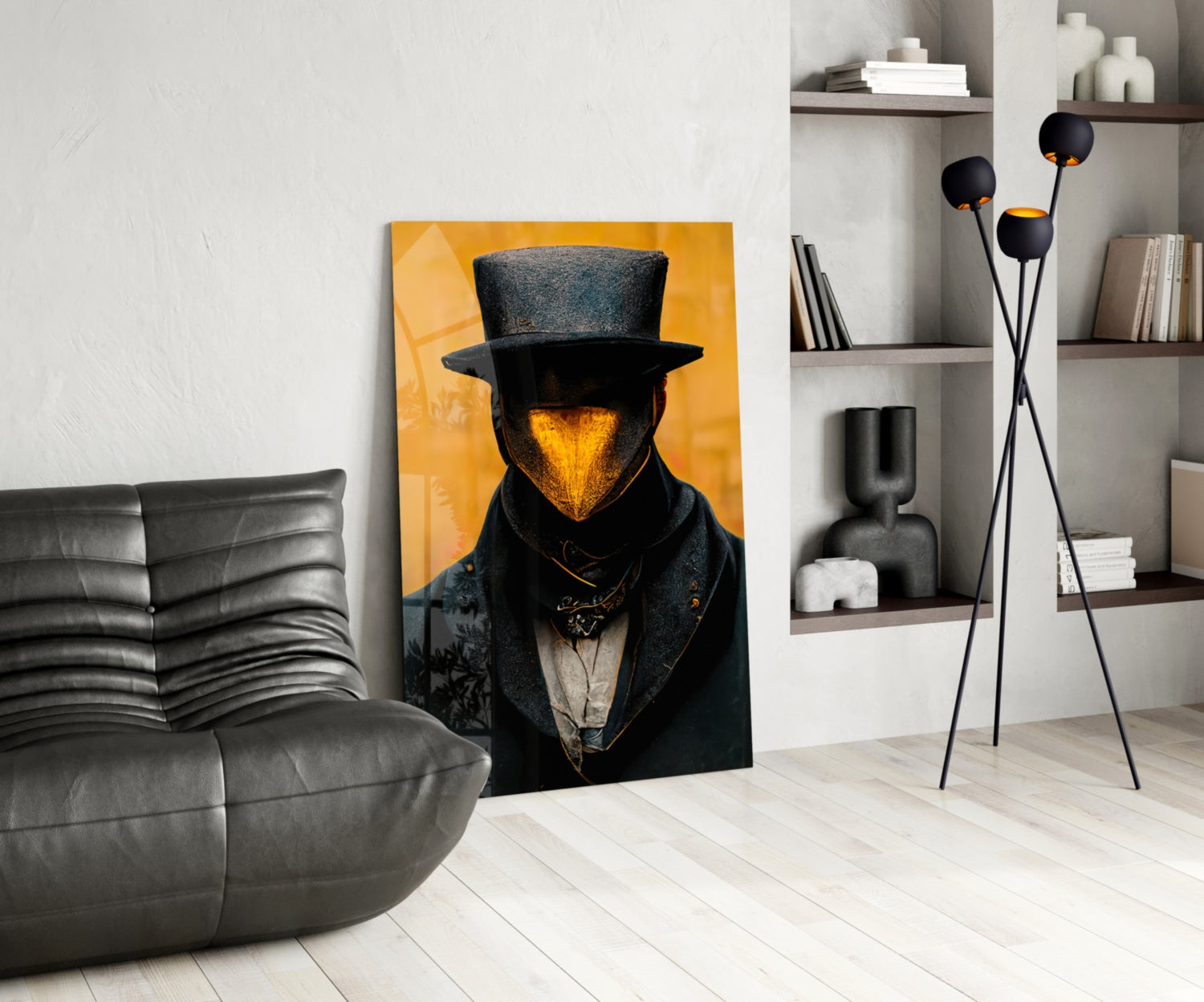 Contemporary living room with "Mr. Beak" artwork featuring a top-hatted figure with golden face against yellow background, displayed next to gray leather sofa and black decorative floor lamp.