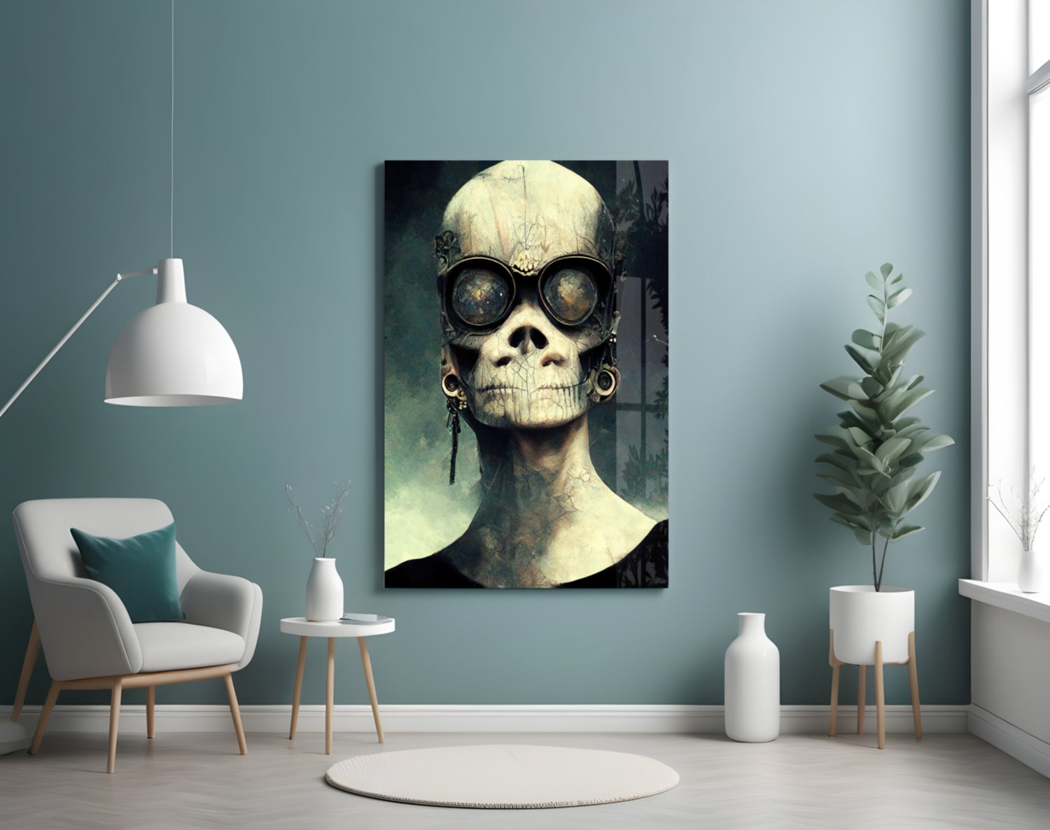 Skull artwork with round dark glasses displayed on teal wall in modern room setting with white furniture and plants.