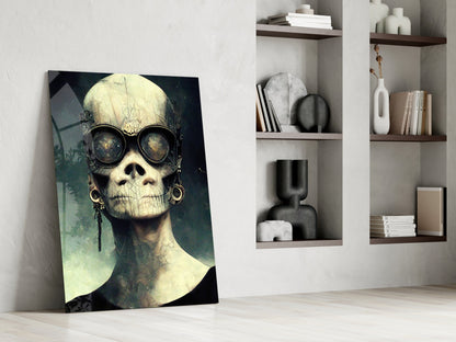 Steampunk skull artwork with round goggles leaning against white wall beside built-in shelving with books and decorative objects.
