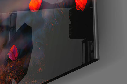 Angled view of glass wall art displaying red tulips and warm-toned landscape with silhouetted interior doorway visible through glass.