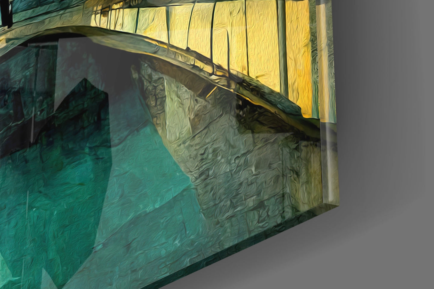Close-up angled view of layered glass wall art with turquoise, green, and yellow translucent panels casting shadows.