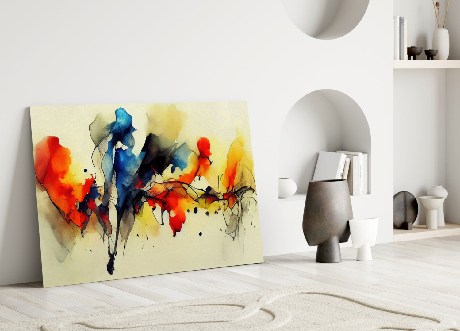 Colorful abstract watercolor glass wall art featuring red, blue, yellow, and black ink splashes on cream background, leaning against white interior wall with shelving.
