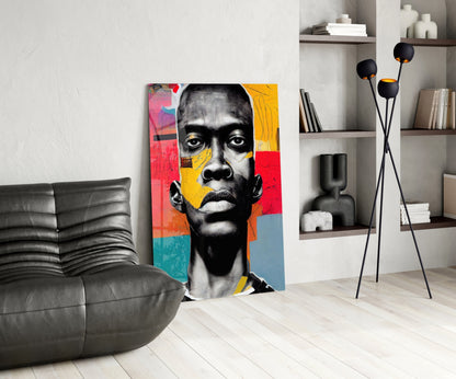 Modern living room interior featuring a colorful pop art portrait canvas with vibrant red, yellow, and blue sections alongside black and white facial imagery.