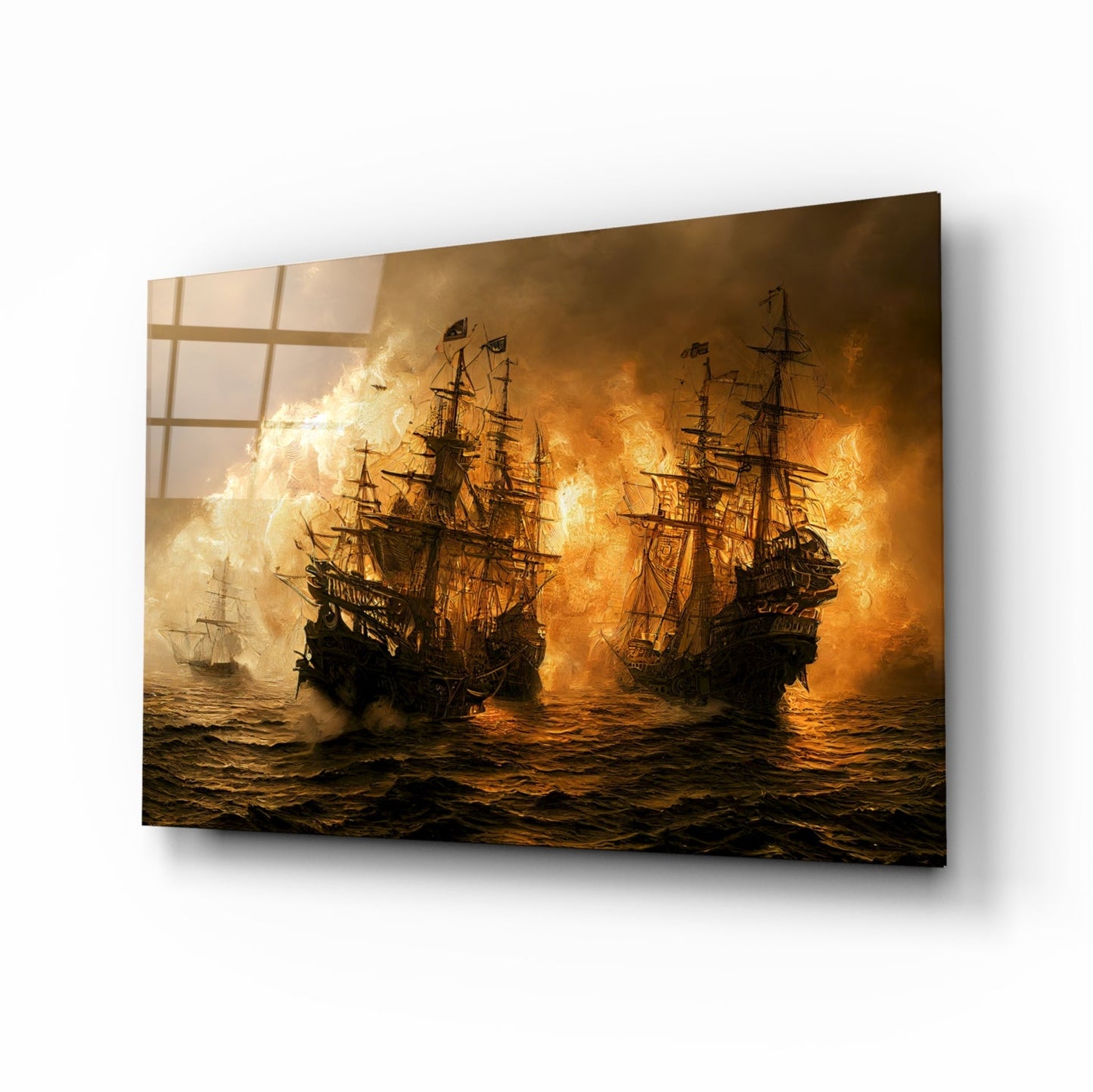 Angled view of glass wall art depicting three tall ships engaged in naval battle with orange flames and smoke against dark seas.
