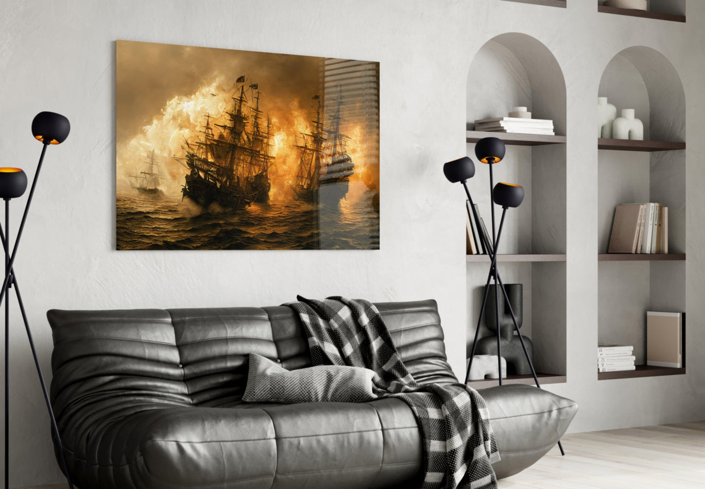Golden-toned naval battle artwork displayed above a dark leather sofa in a modern living room setting.