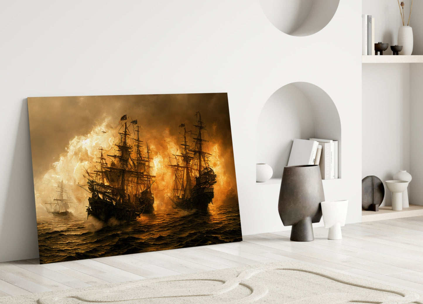 Golden-toned glass wall art depicting dramatic naval battle scene with sailing ships and explosions, displayed leaning against white minimalist interior wall.