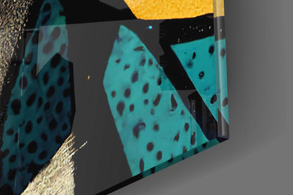 Close-up angled view of turquoise glass panels with dark red spotted pattern, displayed against textured beige and gray background with yellow accent.