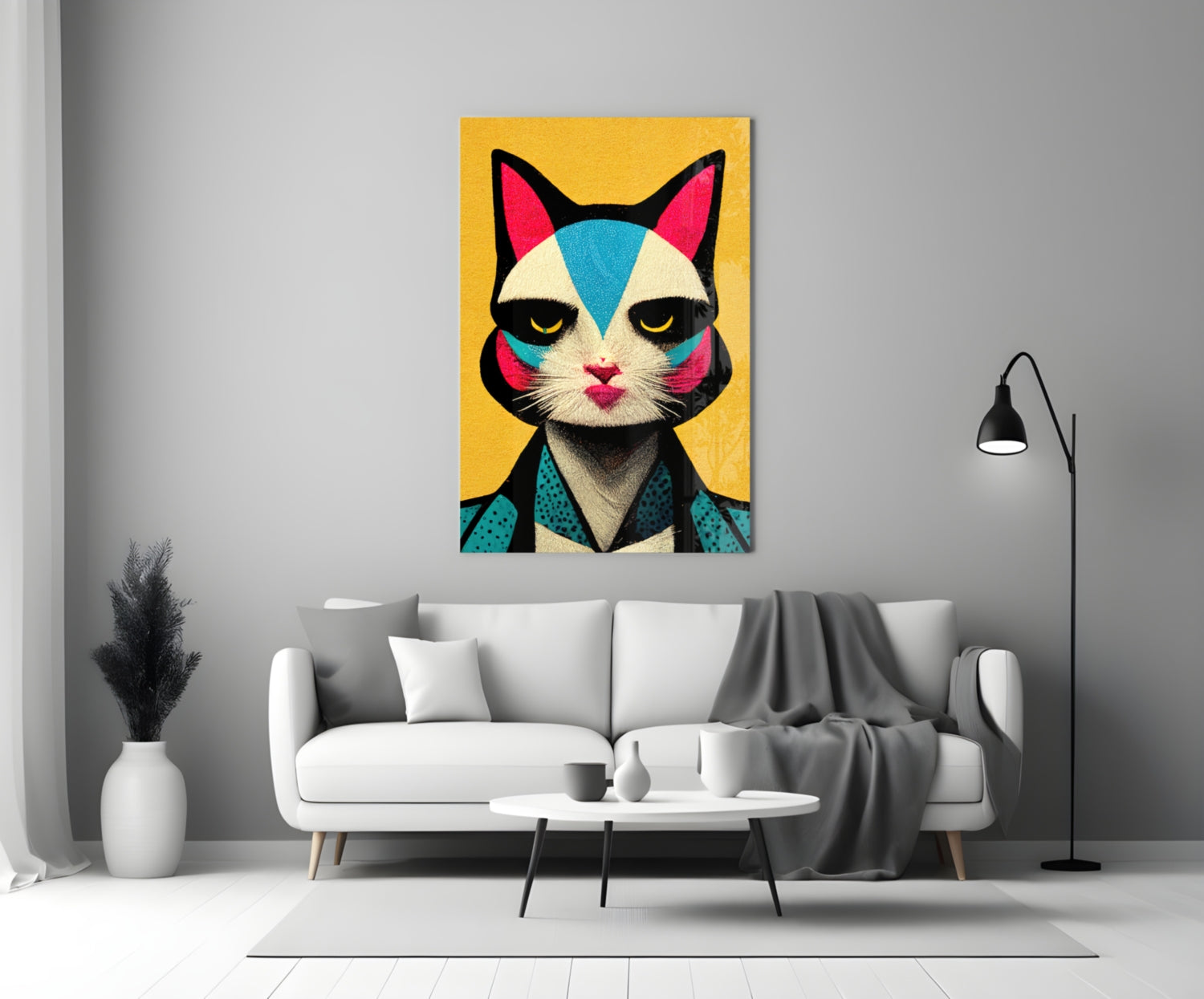 Colorful pop art cat portrait with yellow background displayed above white sofa in modern living room setting.