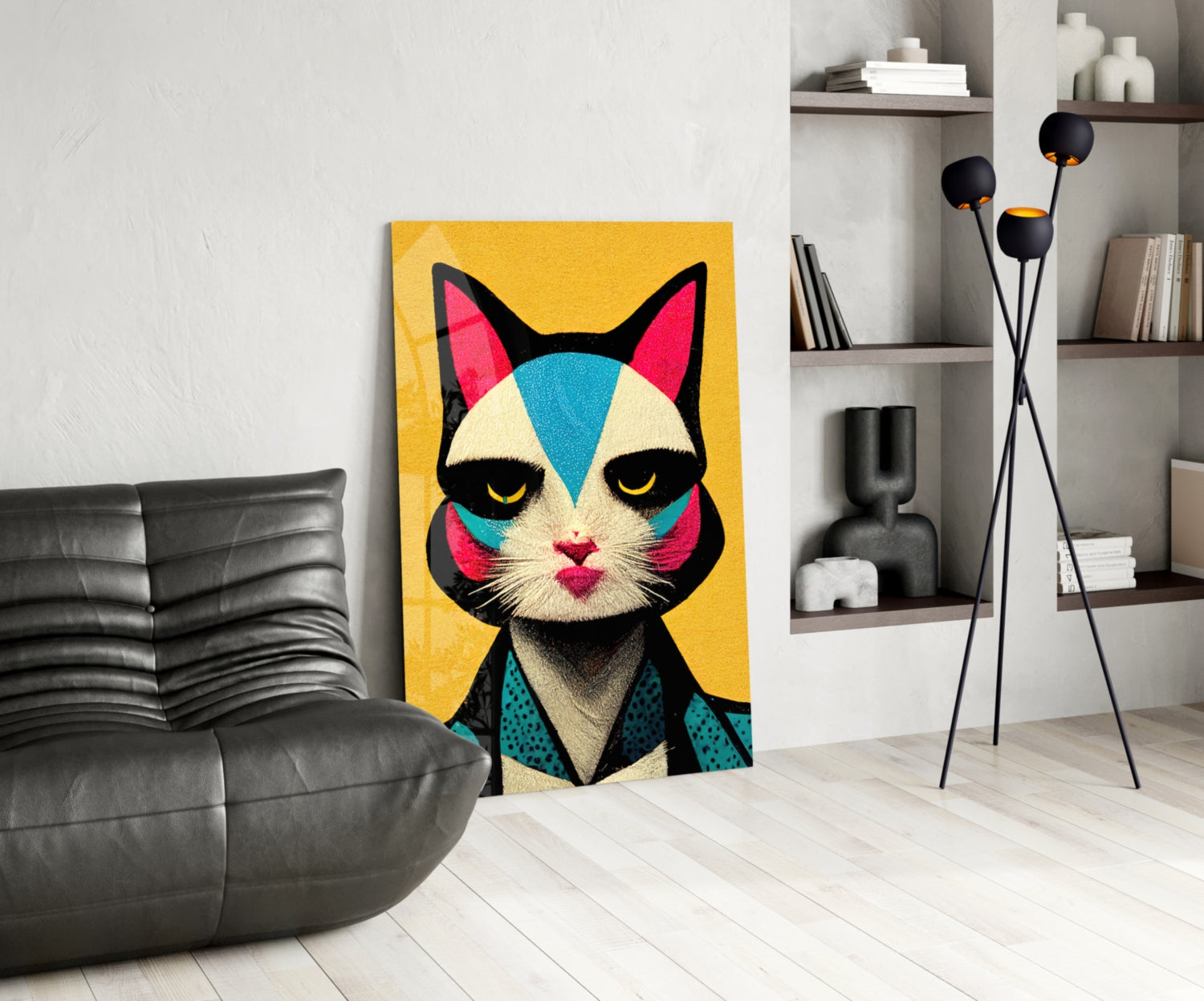 Colorful pop art cat portrait with yellow background displayed in modern living room with black sofa and shelving.