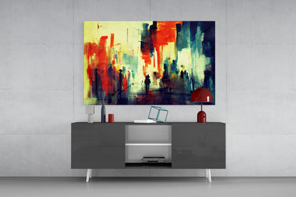 Colorful abstract street scene with red, yellow, and teal tones displayed above a dark media console in a modern interior setting.