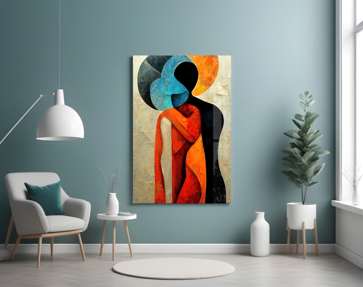 Abstract colorful glass wall art depicting embracing figures in red, blue, and orange tones displayed in modern interior setting.