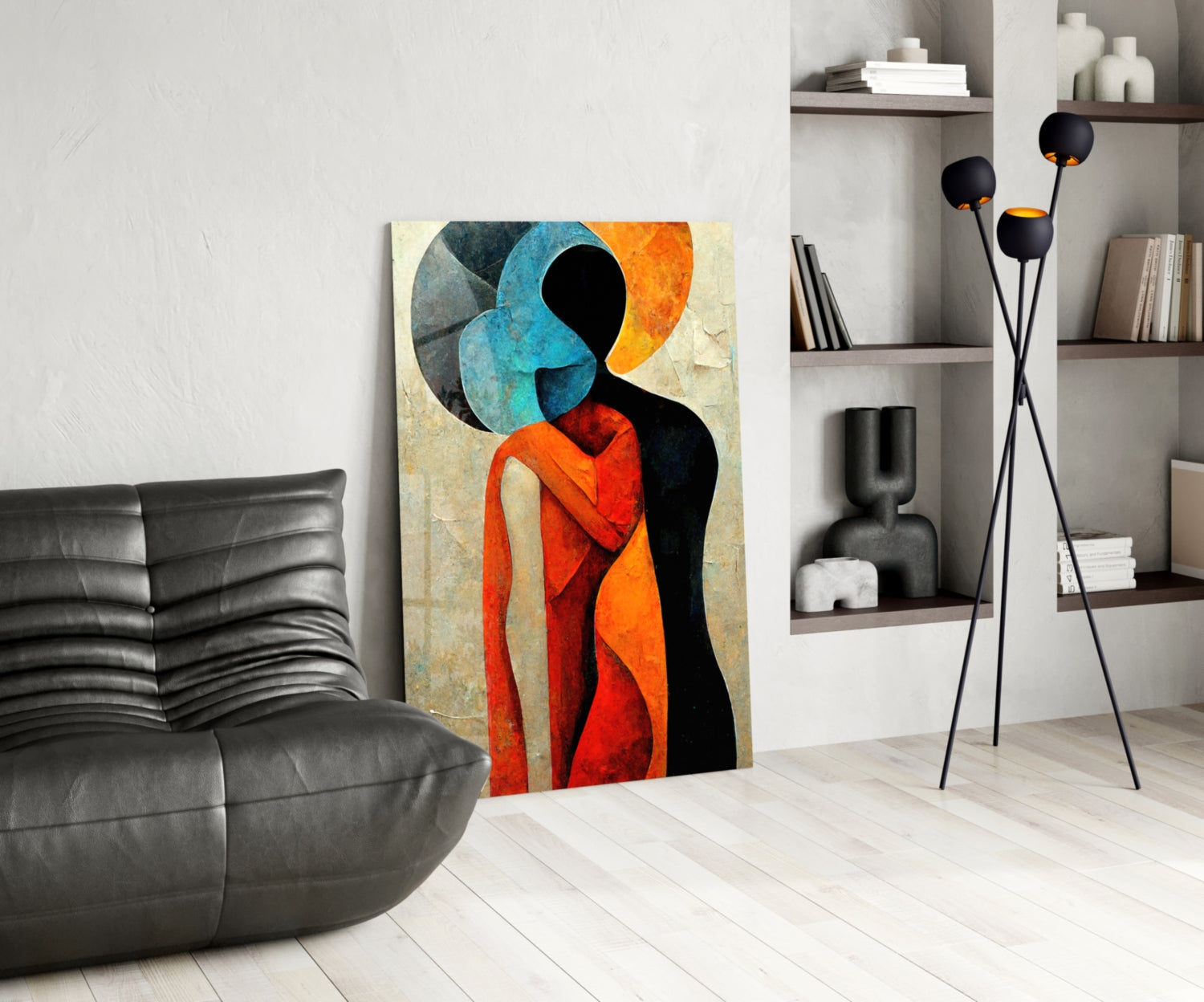 Colorful abstract glass artwork featuring silhouetted figure in red and orange with blue circular shapes displayed in modern living room setting.