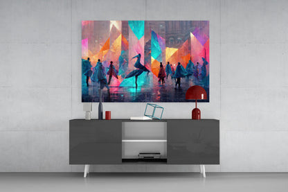 Colorful abstract glass wall art displaying silhouetted figures and geometric shapes in vibrant pink, blue, orange, and yellow tones, mounted above a dark console table.